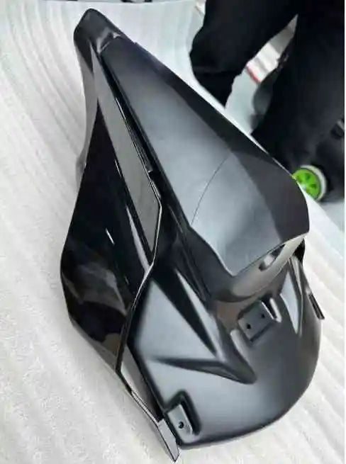 modified Qiangjiang S 550s R1 with a camel hump rear wing and rear spoiler.